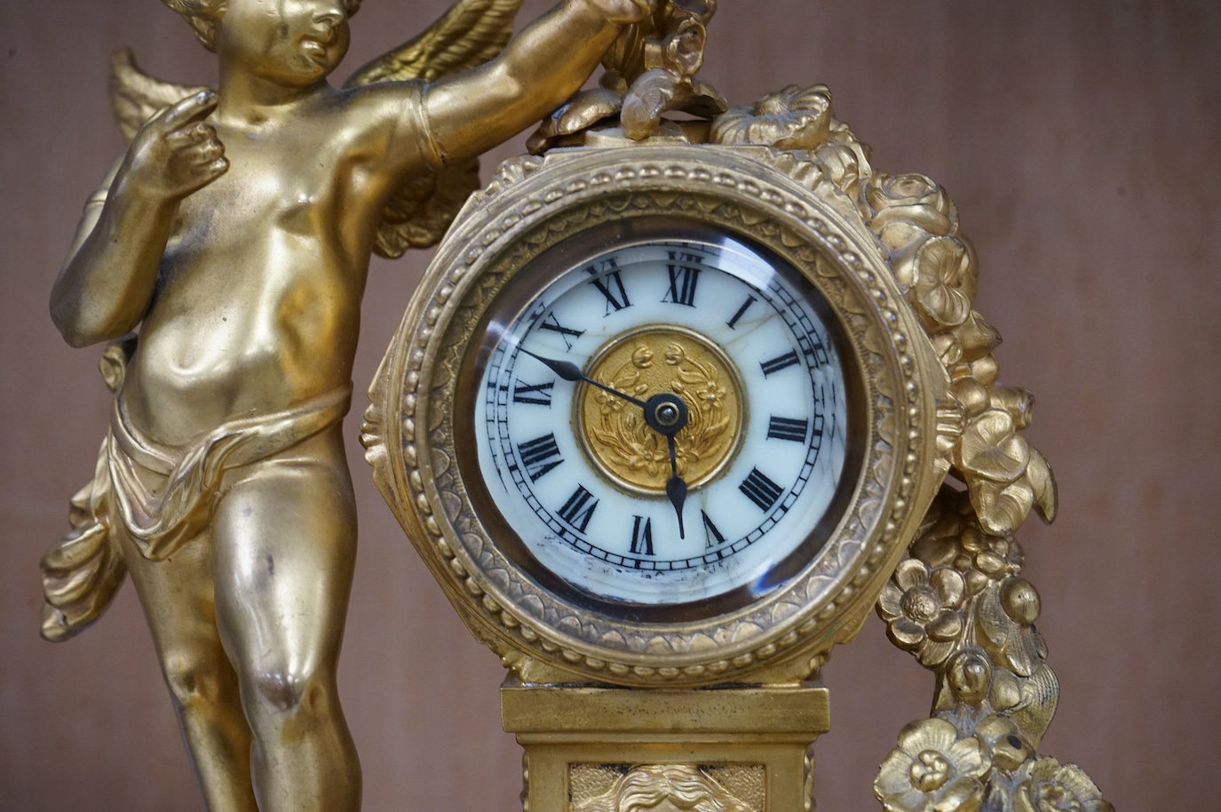 A late 19th century gilt metal cherub timepiece, Ansonia clock company movement, 21cm high